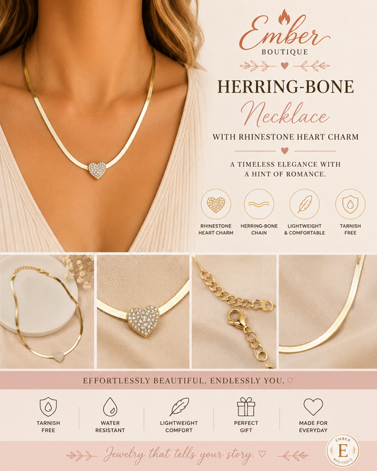 Shop our gold herringbone necklace featuring a sparkling rhinestone heart charm. Tarnish-resistant, elegant, and perfect for layering, gifting, or everyday wear.
