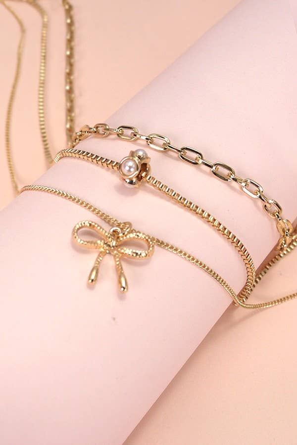 MULTI LAYER PEARL BOW CAHRM NECKLACE | 80N605 - Ember Boutique